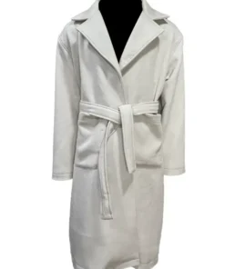 This Charity Jones Christmas Unwrapped wool coat in off-white features a stylish wrap design, notched lapels, and a matching belt for a festive look.