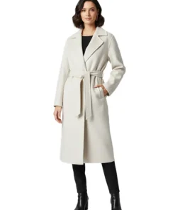 A model showcases the Christmas Unwrapped coat Charity Jones style, featuring a longline cut and belted waist, perfect for holiday coat collections.