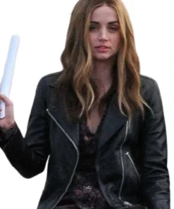 Women's fitted black leather motorcycle jacket with asymmetric zipper and wide lapels.