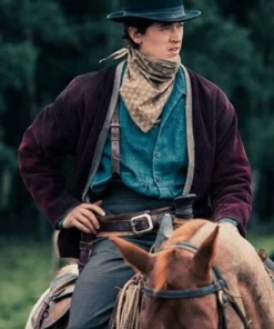 A medium shot of the Tom Blyth Corduroy Jacket worn by the lead in Billy the Kid, featuring a rugged brown texture and traditional frontier apparel.