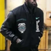 LeBron James wearing the black varsity Tiffany and Co jacket. The front features a "Tiffany & Co," "New York" globe patch, and "Victory" patch with a turquoise Nike swoosh, confirming this is the iconic LeBron James jacket tonight.