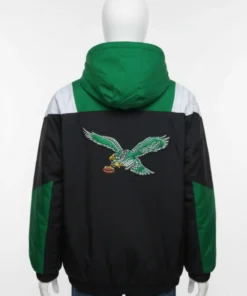 Back view of a black and green eagles jacket on a manniquine starter featuring a large embroidered throwback logo on a premium heavy nylon windbreaker shell.