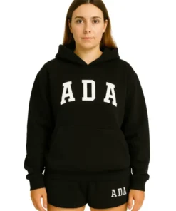 Front view of a woman wearing an oversized black hoodie with "ADA" printed in large white collegiate lettering on the chest.