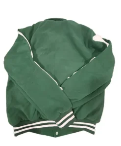 Back view of the green Amiri bomber jacket showing the full sleeves with partial bone appliqués visible near the shoulders and the white-striped ribbed hem and cuffs. This high-end bomber jacket for men is a popular Amiri jacket style.
