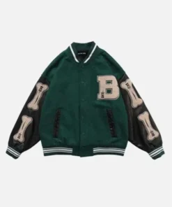 Front of a green varsity jacket with black leather sleeves featuring large stitched bone patches and a letter 'B' patch.