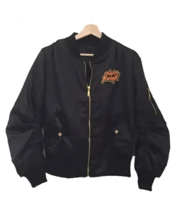 Black Daft Punk Bomber Jacket hanging on hanger with gold zipper and logo patch on the chest.