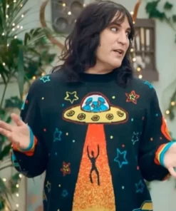 Close-up of GBBO Season 15 Noel Fielding Alien Sweater on Noel Fielding, showing the UFO, rainbow cuffs, and space alien jumper design.
