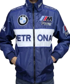 A man wearing a BMW Sauber F1 x Petronas Racing Jacket with Credit Suisse shoulder details and BMW Petronas M Power F1 Sauber Team Dell branding.