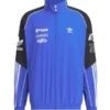 Front view of Adidas Adicolor Motorcore Woven Jacket in blue and black with bold white branding and logos