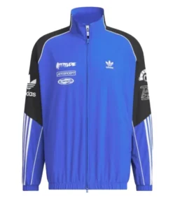 Front view of Adidas Adicolor Motorcore Woven Jacket in blue and black with bold white branding and logos