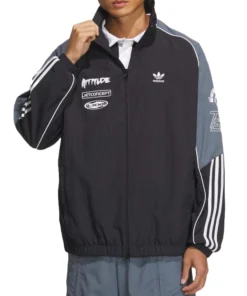 Front view of black and gray Adidas Adicolor Motorcore Woven Jacket worn by male model