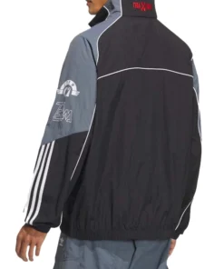 Rear view of black and gray Adidas Adicolor Motorcore Woven Jacket with red Traxion collar detail