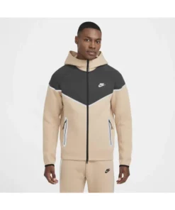 Front side of cream Nike Tech reflective jacket and matching pants featuring full-zip and reflective design.