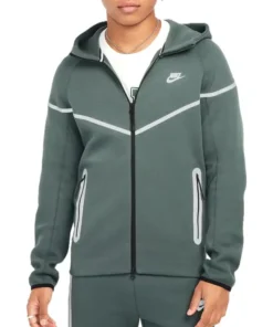 Front side of green Nike Tech reflective tracksuit for men with zip-up jacket and joggers.