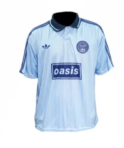 Front view of the sky blue Oasis Adidas jersey featuring the classic band logo and Oasis tour jacquard jersey pattern with navy collar details.