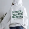 Back view of Mental Health Hoodie with text