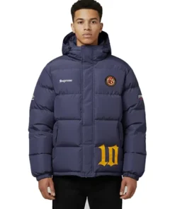 Front view of a model wearing the navy blue Supreme Umbro Down Puffer Jacket with a hood. It features 'Supreme' on the chest, a round patch emblem, and a large yellow '10' graphic near the hem.