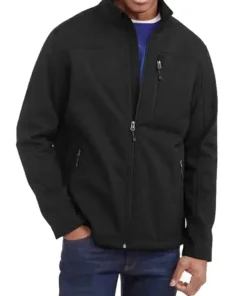 Model wearing a black Swiss Tech jacket for men. This swiss tech coat is a versatile men's softshell jacket and swiss tech apparel.
