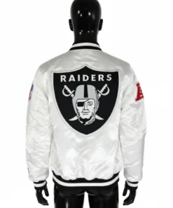 Back view of a mannequin wearing a white Raiders satin bomber jacket with the large Raiders logo patch on the back.