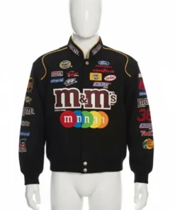 Vintage JH Design M&M NASCAR racing jacket, black with multi logos, on a white mannequin for product display.