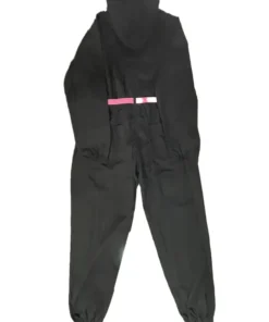 Back view of the Squid Games black jumpsuit laid flat, emphasizing the black suit fabric and the horizontal pink belt visible at the back.