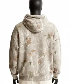 Back view of a mannequin wearing an oversized white camo Abercrombie hoodie. The cream and gray camo pattern includes large maple leaves.