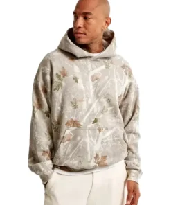 Model wearing white camo sweatshirt Abercrombie styled with casual trousers for a streetwear look.