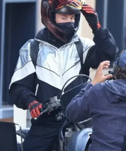 Barry Keoghan two-tone jacket from Crime 101 featuring a grey and black sporty streetwear vibe.