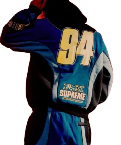 Rear view of blue and black Supreme Fox Racing Zip Up Hooded Sweatshirt with Pant displaying large 94 graphic and Fox Supreme Factory Team details.