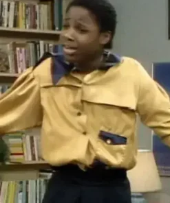 Theo Huxtable wearing the iconic yellow Gordon Gartrelle Shirt, a classic look that inspired the men's Gordon Gartrell shirt and the Anthony Mackie Gordon Gartrell Shirt collection.