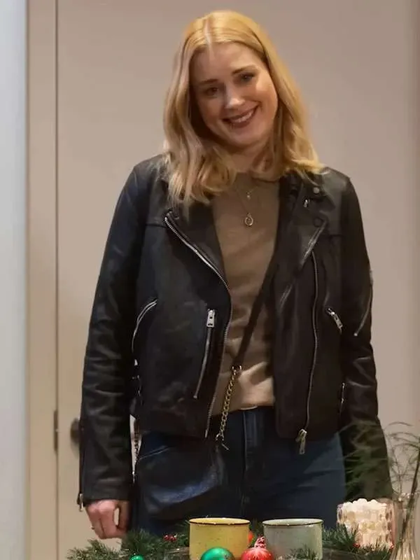My Secret Santa Alexandra Breckenridge Taylor Black Biker Leather Jacket, featuring a classic women's moto style with a zippered front and lapel collar, as worn by the Taylor character in the movie.