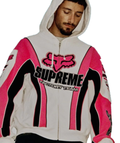 Model wearing Supreme Fox Racing Zip Up Hooded Sweatshirt with Pant in pink and white featuring bold Supreme Factory Team logo and Fox Racing design.