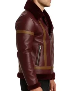Side profile of men’s maroon leather shearling jacket with zipper pocket and fur cuffs, elegant and warm winter wear for men.