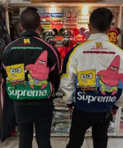 Two people standing with their backs to the camera, wearing the black and white versions of the SpongeBob SquarePants Supreme Racing Jacket, both featuring Spongebob and Patrick on the back.