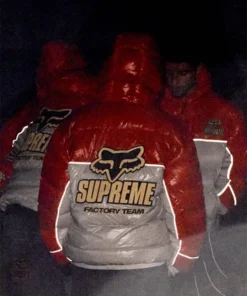 Group wearing Supreme Fox Racing shiny down puffer jackets with reflective detailing, streetwear insulated outerwear.