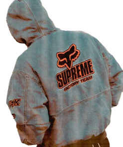 view of Supreme Fox Racing Denim Hooded Work Jacket with bold Supreme Factory Team logo and fox emblem in red.