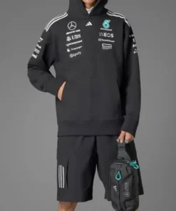 Model wearing the Adidas Mercedes AMG Petronas Formula 1 fan hoodie in black, perfect casual wear and street style.