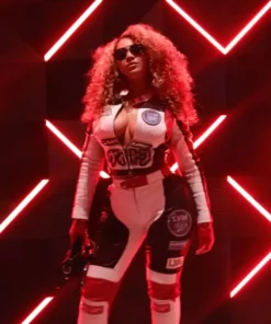 Beyoncé poses under red neon lights in a Louis vuitton Las Vegas F1 motorsport track suit.
