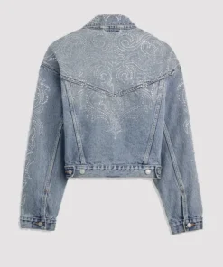 Back view of the light wash Beyoncé x Levi's Shrunken 90s Denim Trucker Jacket featuring an intricate, Western-inspired paisley pattern made of rhinestones across the upper back yoke and down the sleeves. The jacket is cropped and has a pointed back yoke design.