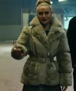 Chanel Cresswell in her oversized fur jacket from The Gentlemen, a bold statement fur jacket look with a belted waist and high hairstyle.