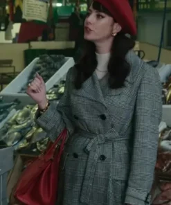 Kaya Scodelario Plaid Trench Coat trench coat and red beret, completing her stylish plaid coat look in a marketplace scene.