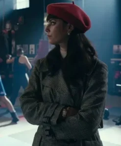 Kaya Scodelario Plaid Trench Coat trench coat and red beret, completing her stylish plaid coat look in a marketplace scene.