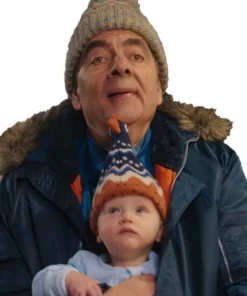 Rowan Atkinson baby series parka jacket. Close-up on Trevor Bingley wearing his Rowan Atkinson Man vs Baby blue jacket and a pom-pom hat.