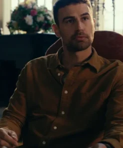 The Gentlemen 2024 Theo James brown shirt close-up, featuring the Eddie Horniman signature brown shirt style for a smart-casual look.