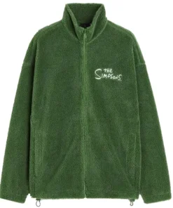 A full-front view of an oversized, dark green sherpa fleece jacket with a high collar and a full zipper. The white embroidered text 