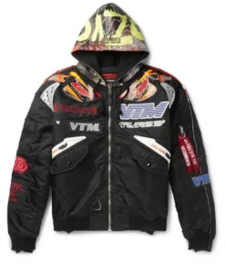 Black Vetements x Alpha Industries logo racing jacket featuring "VTM TURBO" text and a colorful graphic hood.