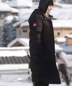 Alexandra Breckenridge long black puffer coat from the movie My Secret Santa. This quilted black coat is ideal for winter.