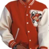Frontal view of Jaafar Jackson wearing the red varsity jacket with a graphic patch. Jaafar Michael Jackson varsity jacket.