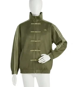 A white mannequin models the Adidas Green Chinese New Year Jacket 2026 with traditional frog buttons, Lunar New Year styling, and classic Adidas 3-stripes on the sleeves.