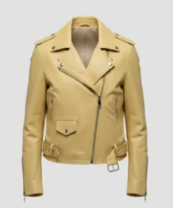 Studio product shot of a pale yellow leather biker jacket featuring an asymmetrical front zipper, silver hardware, waist belt, and snap-down lapels.